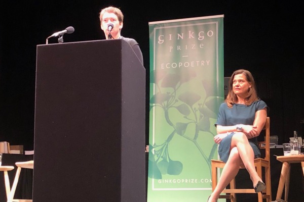 Jemma Borg reads onstage on at the Ginkgo Prize 